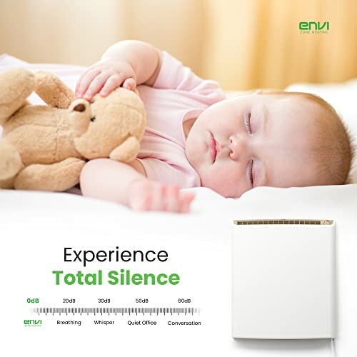 Sleeping baby with teddy bear near a quiet heater, showcasing silence levels.