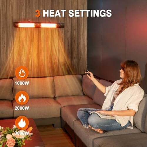 A woman using the remote control for the wall-mounted heater, with three heat settings.